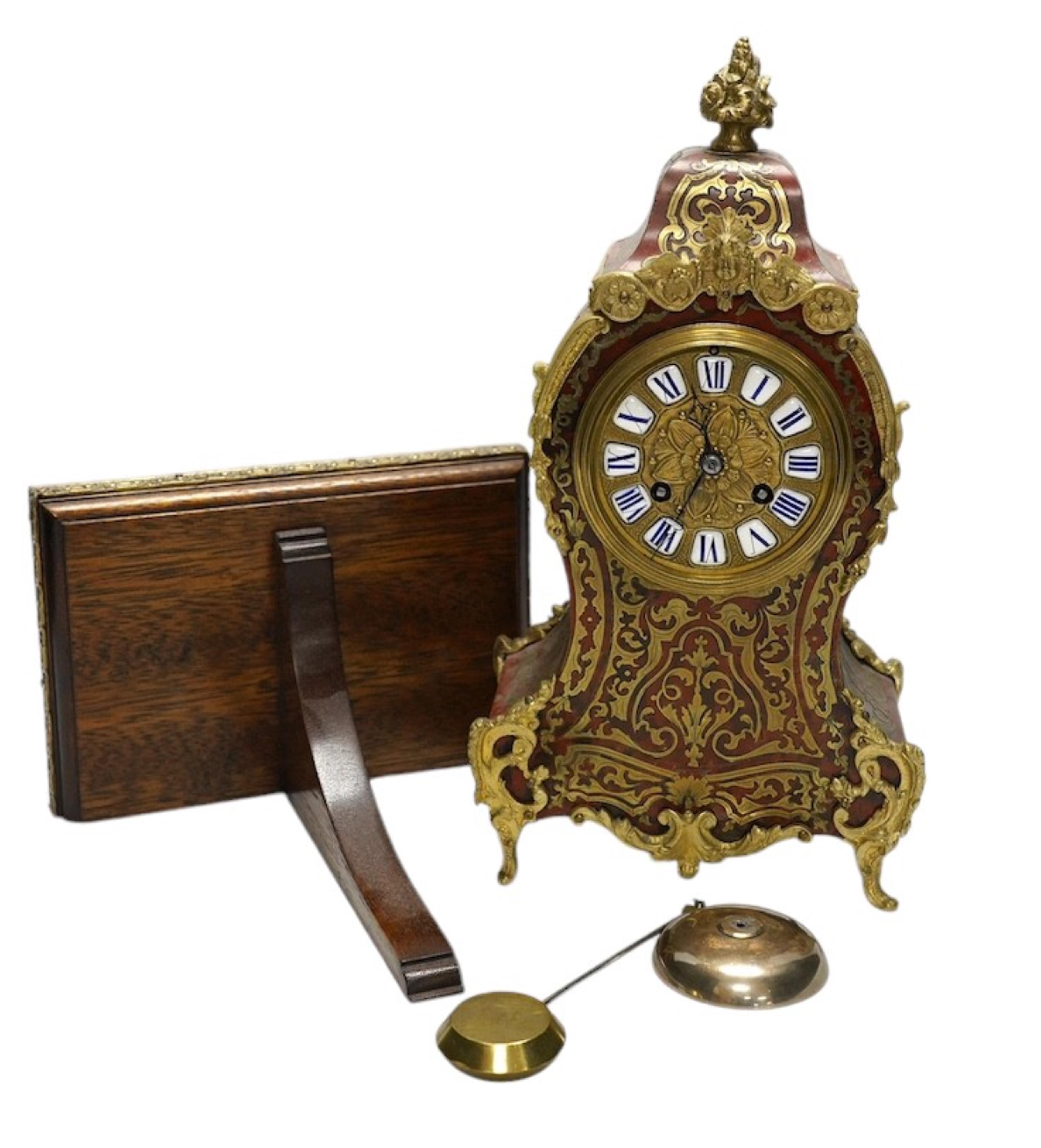 A Louis XV style red boulle eight day mantel clock, with bracket and pendulum, clock 30cm high. Condition - fair, not tested